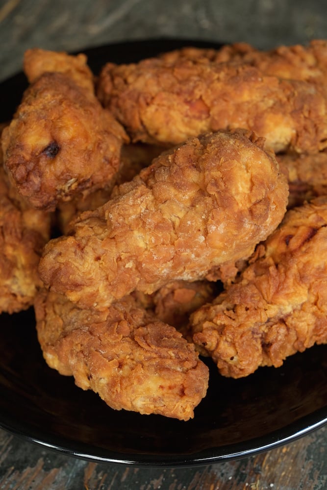 A pile of Buttermilk Deep Fried Chicken Wing on a plate.