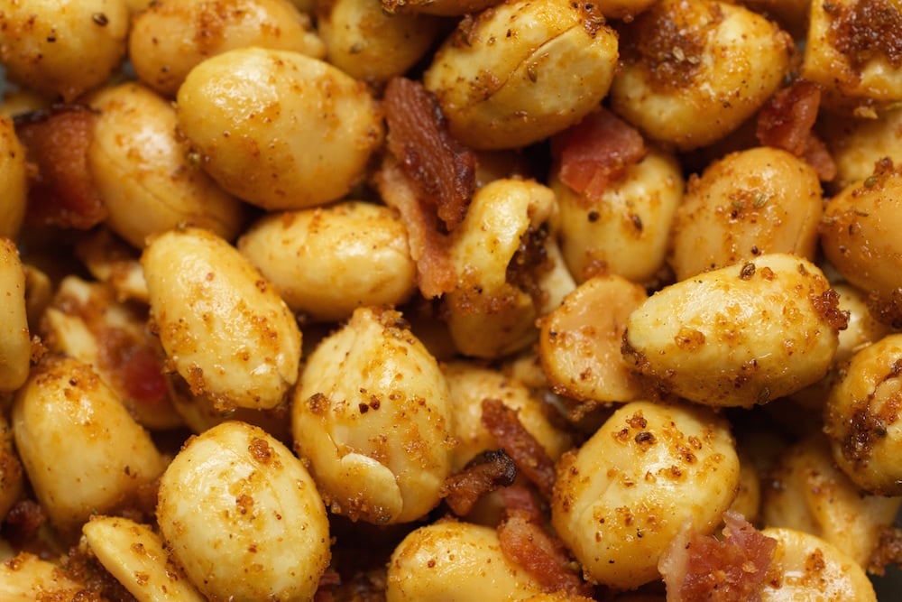 Extreme close up of Old Bay & Bacon seasoned peanuts.