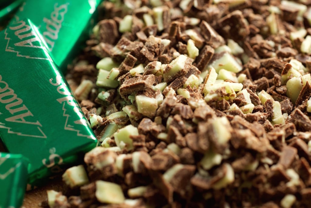 Extreme close up of chopped Andes mints used to coat mint chocolate cheesecake popsicles