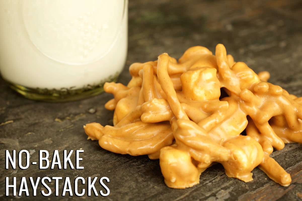 A close up of a butterscotch haystack with a glass of milk in the background. Text in the lower left hand corner reads "No-Bake Haystacks"