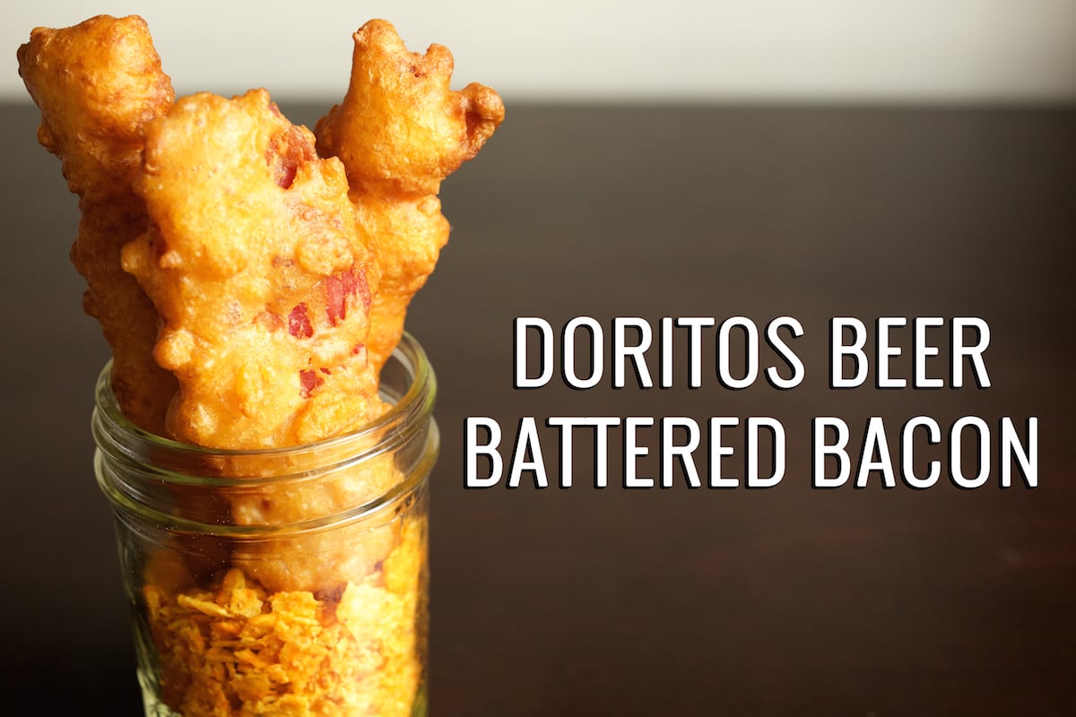 A jar of battered and deep fried bacon with crushed Doritos in the bottom. Text next to it reads "Nacho Doritos Beer Battered Bacon"