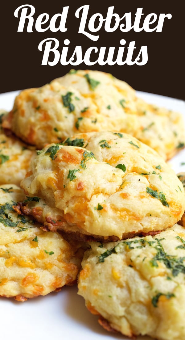 A white plate full of homemade cheddar bay biscuits. Text at the top reads "Red Lobster Biscuits".