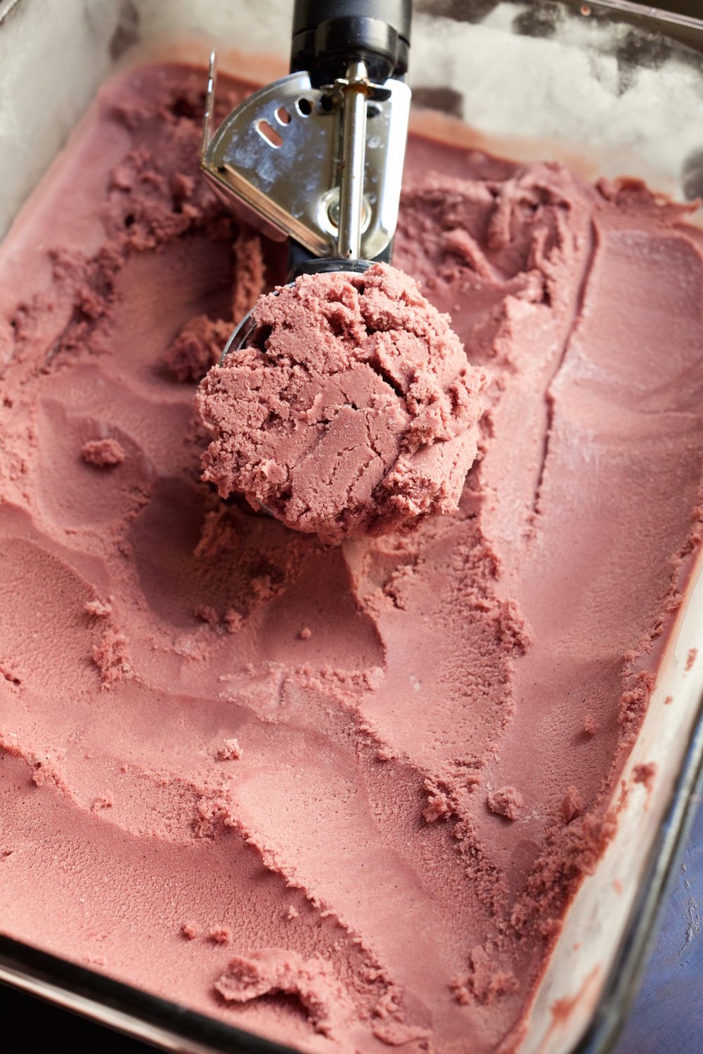 Red wine ice cream being scooped