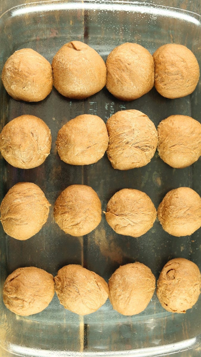 Outback steakhouse rolls proofing in a glass casserole dish.