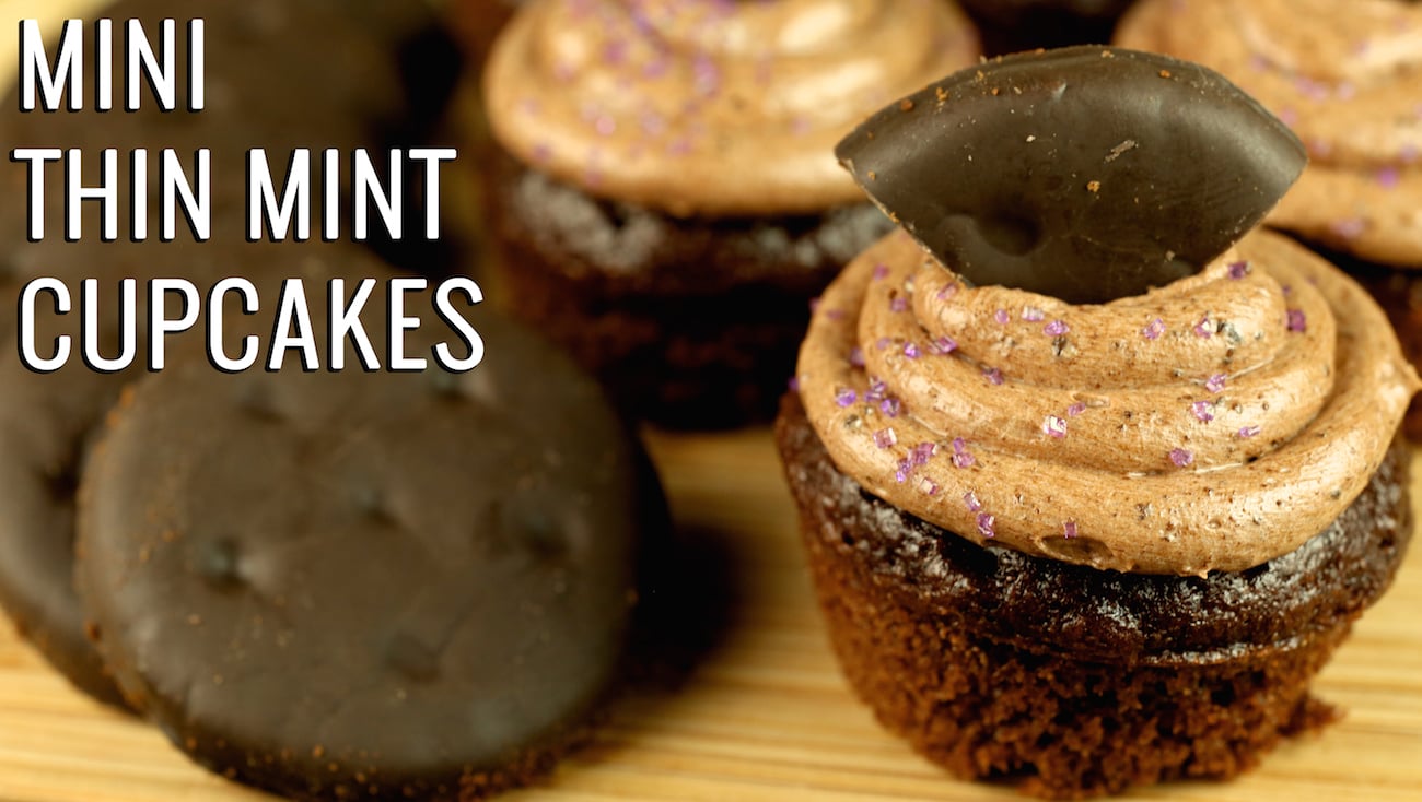 A small chocolate cupcake with chocolate icing sits next to think mint cookies. Text reads "Mini Thin Mint Cookies Cupcakes".