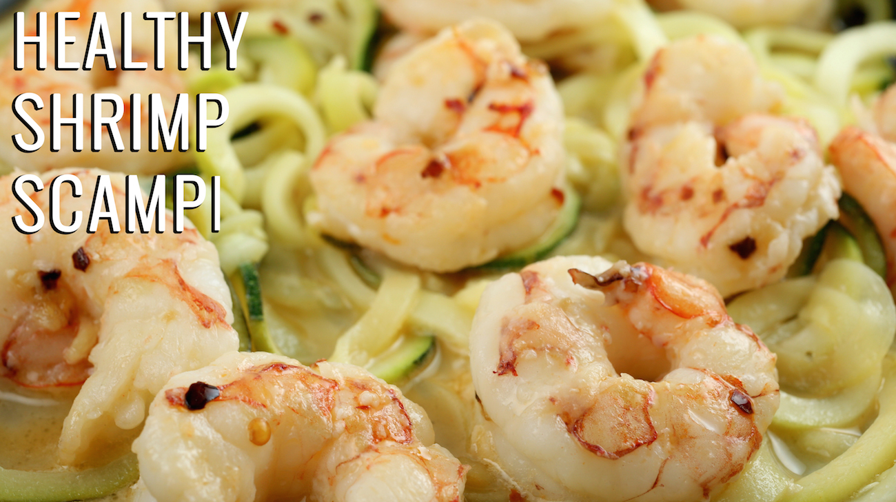 Close up of zucchini noodles with shrimp on top. Text reads "Healthy Shrimp Scampi with Zucchini Noodles"