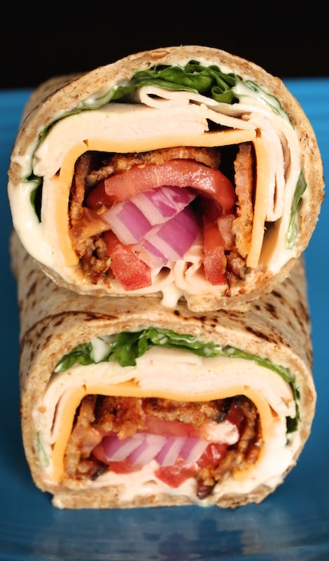Bacon Ranch Turkey Wrap sliced in half and stacked on top of each other.