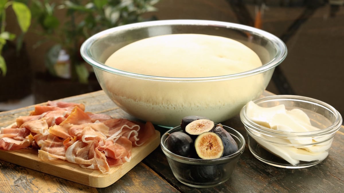 Fig Prosciutto Pizza Ingredients - homemade dough, fresh sliced prosciutto, black figs, fresh sliced mozzarella cheese.