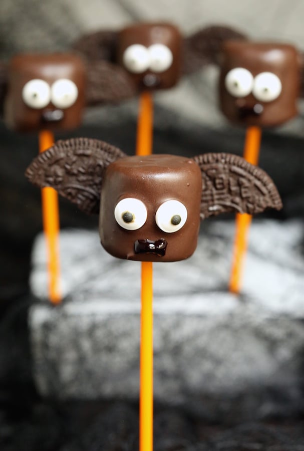 A marshmallow that's been dipped in chocholate and had candy eyes added as well as half an Oreo cookie on each side to make it look like a bat.