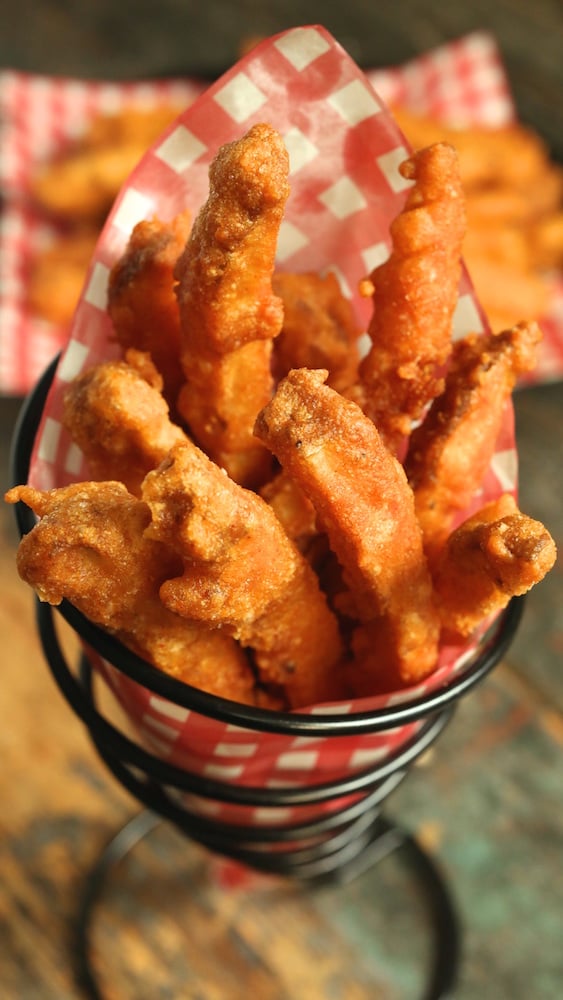 Double Beer Battered Cajun Fries in a paper cone