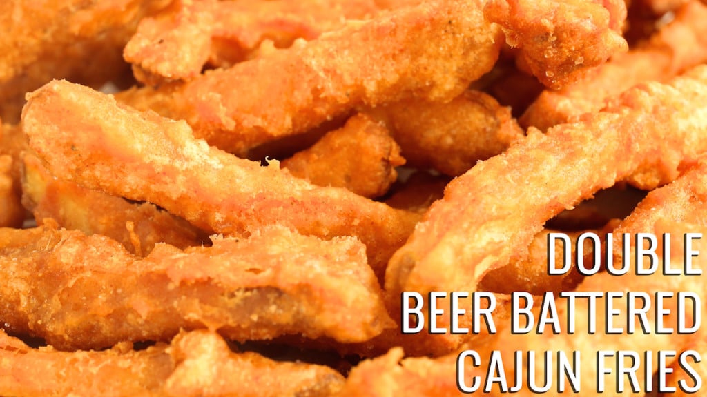 A close up of French fries with a crunchy coating. Text reads "Double Beer Battered Cajun Fries"