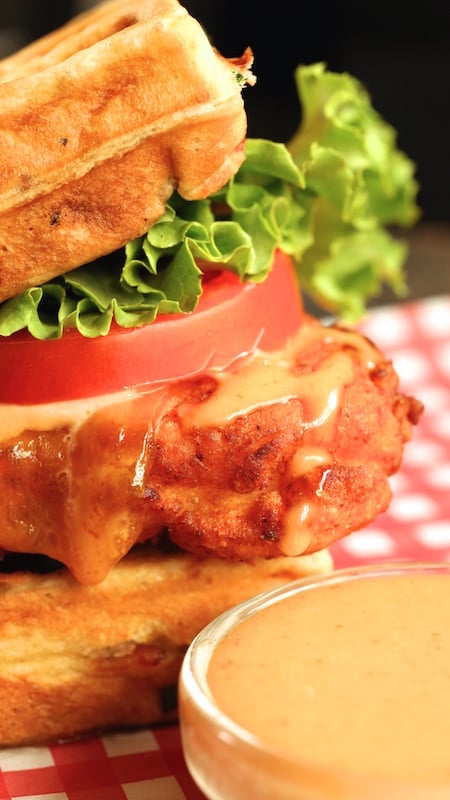Close up of a Buttermilk Fried Chicken & Waffle Sandwich.