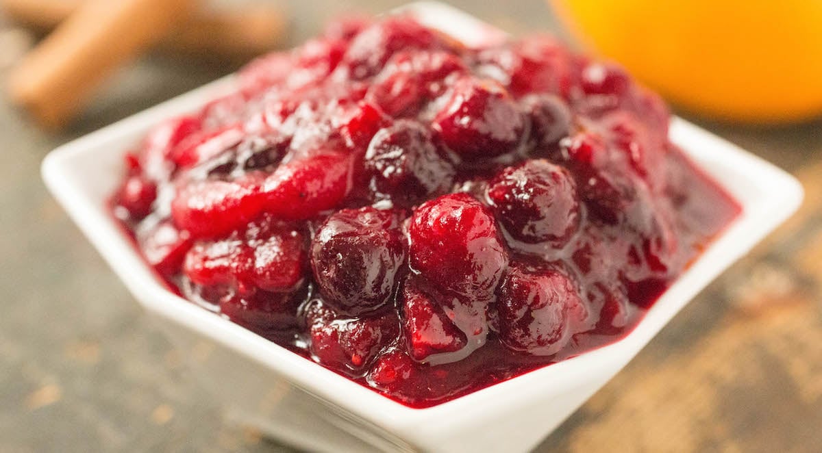 Cranberry compote in a white serving dish.