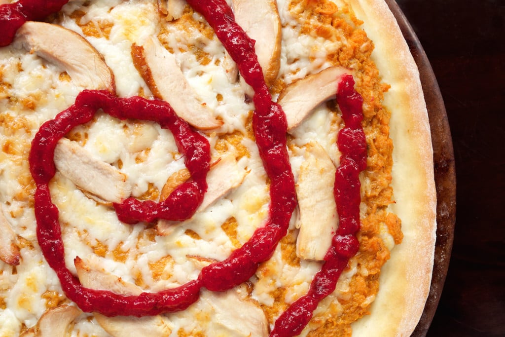 Thanksgiving Leftovers Pizza with cranberry sauce swirl.