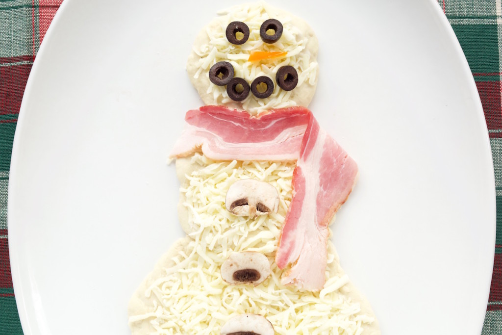 Snowman shaped Pizza made with ranch, bacon, olives, and mushrooms.