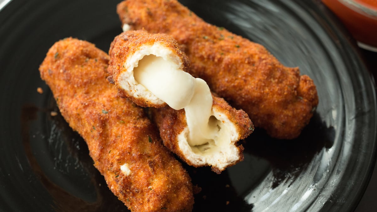 Mozzarella Stick Chicken Fries - Mozzarella sticks are wrapped in seasoned ground chicken, then breaded and deep fried.