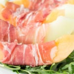 Sweet melon wrapped in salty prosciutto then topped with creamy burrata. Easy, low-carb lunch.