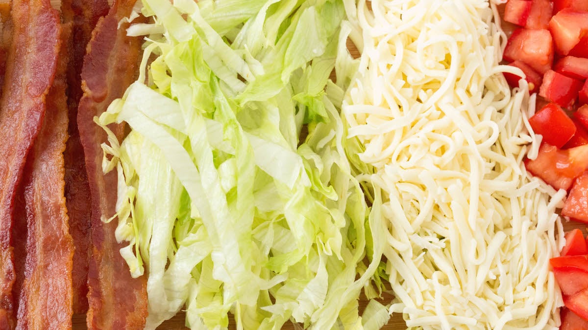 Ingredient for BLT Waffle Fries: Bacon, Lettuce, Mozzarella, and tomato.