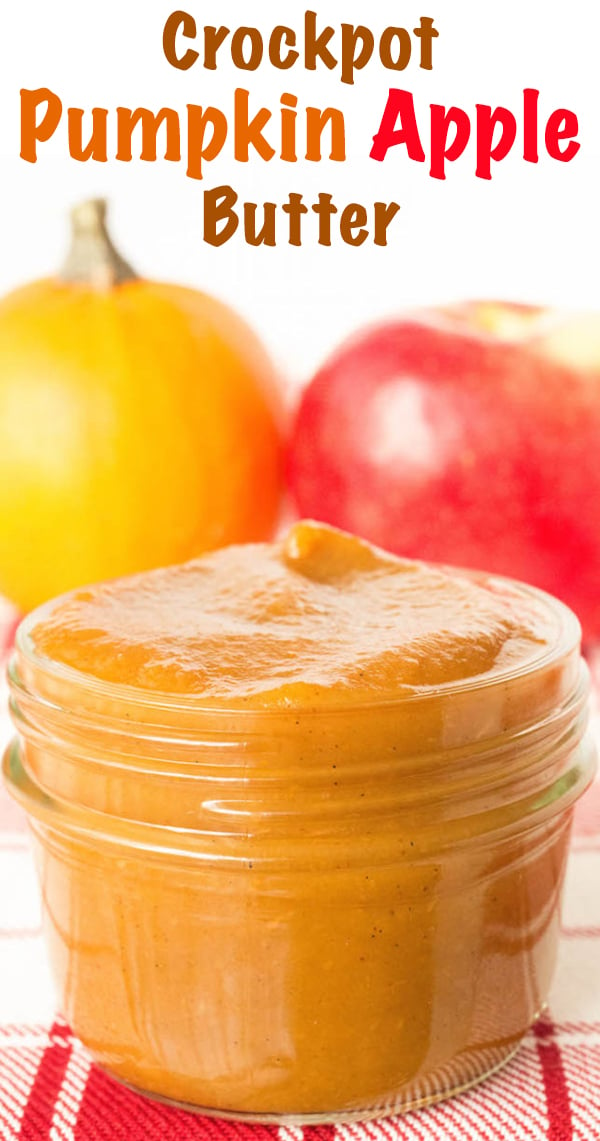 A small glass jar of pumpkin apple butter sits in front of a pumpkin and an apple. Text at the top reads "Crock Pot Pumpkin Apple Butter"