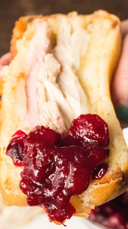 A Thanksgiving Leftovers Monte Cristo Sandwich that's been dipped in cranberry sauce