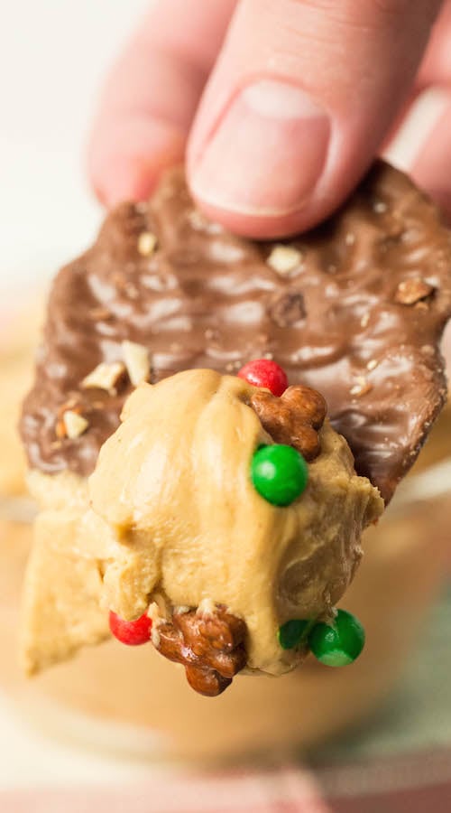 A chocolate potato chip that has been dipped in gingerbread dip.