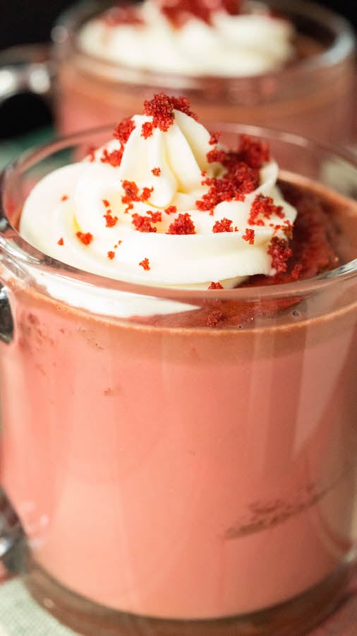 Close up of a Red Velvet Hot Chocolate topped with Cream Cheese Whipped Cream