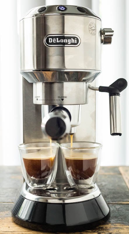 A Delonghi Espresso Machine making two shots of espresso. 