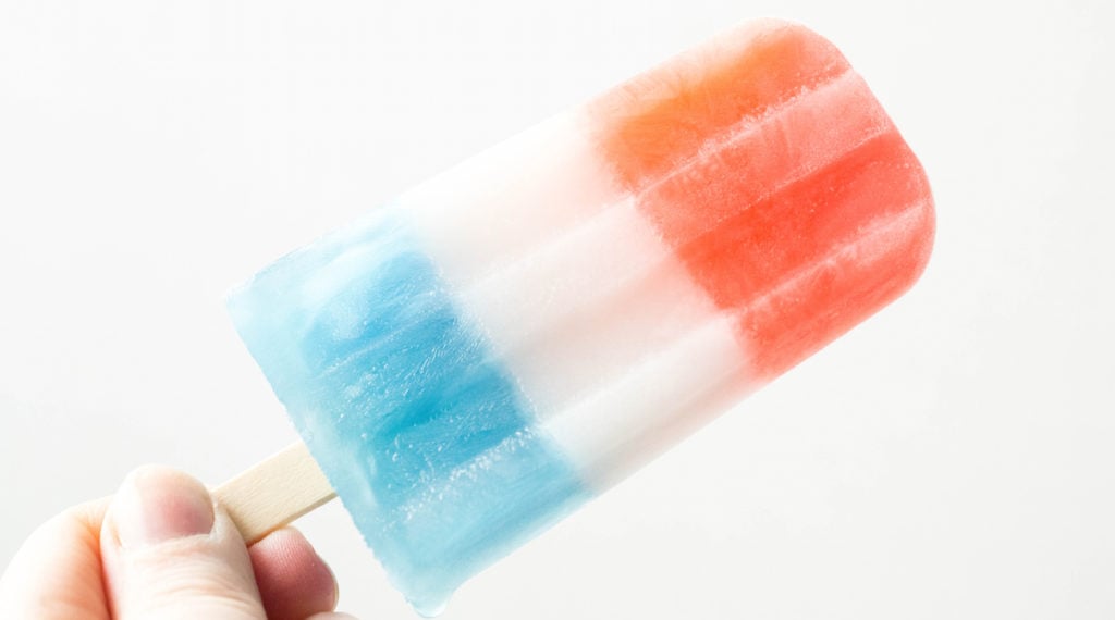 Homemade Bomb Pops with layers of red, white, and blue.