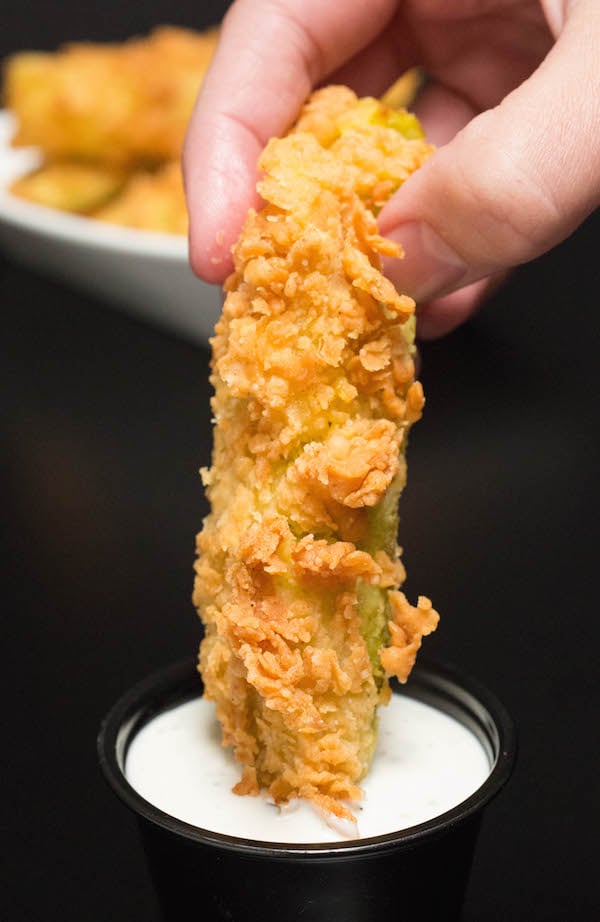 A Chicken Fried Pickle being dipped in ranch.