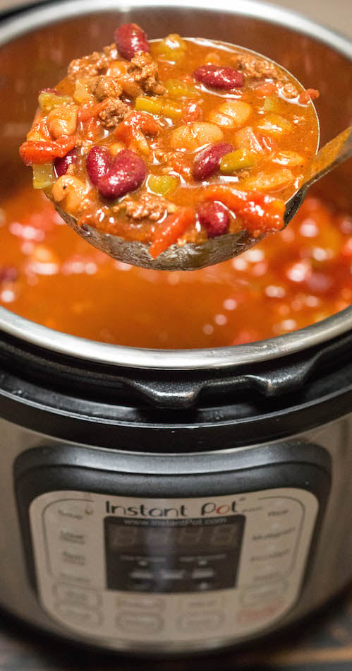 Close up of a ladle of Wendy's copycat Chili in an Instant Pot.