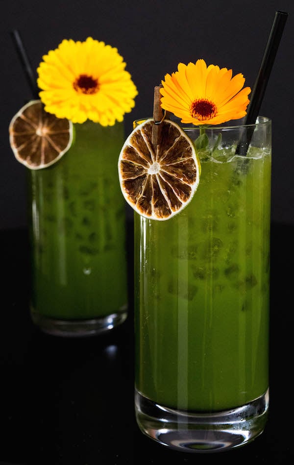 Two highball glasses of Green Juice Margaritas.
