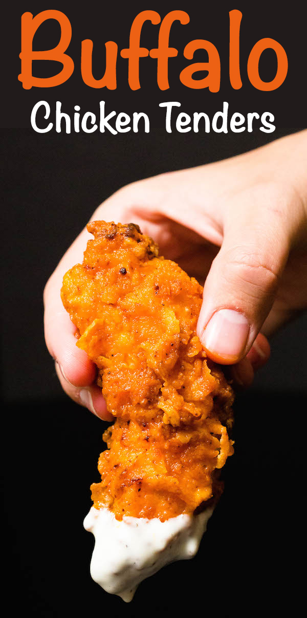 A hand holds up an orange chicken tender dipped in ranch. Text at the top reads "Buffalo Chicken Tenders".