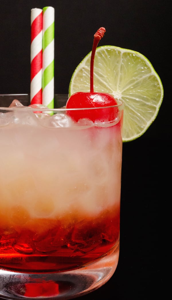 Close up of a layered Cherry Limeade Vodka Cocktail.