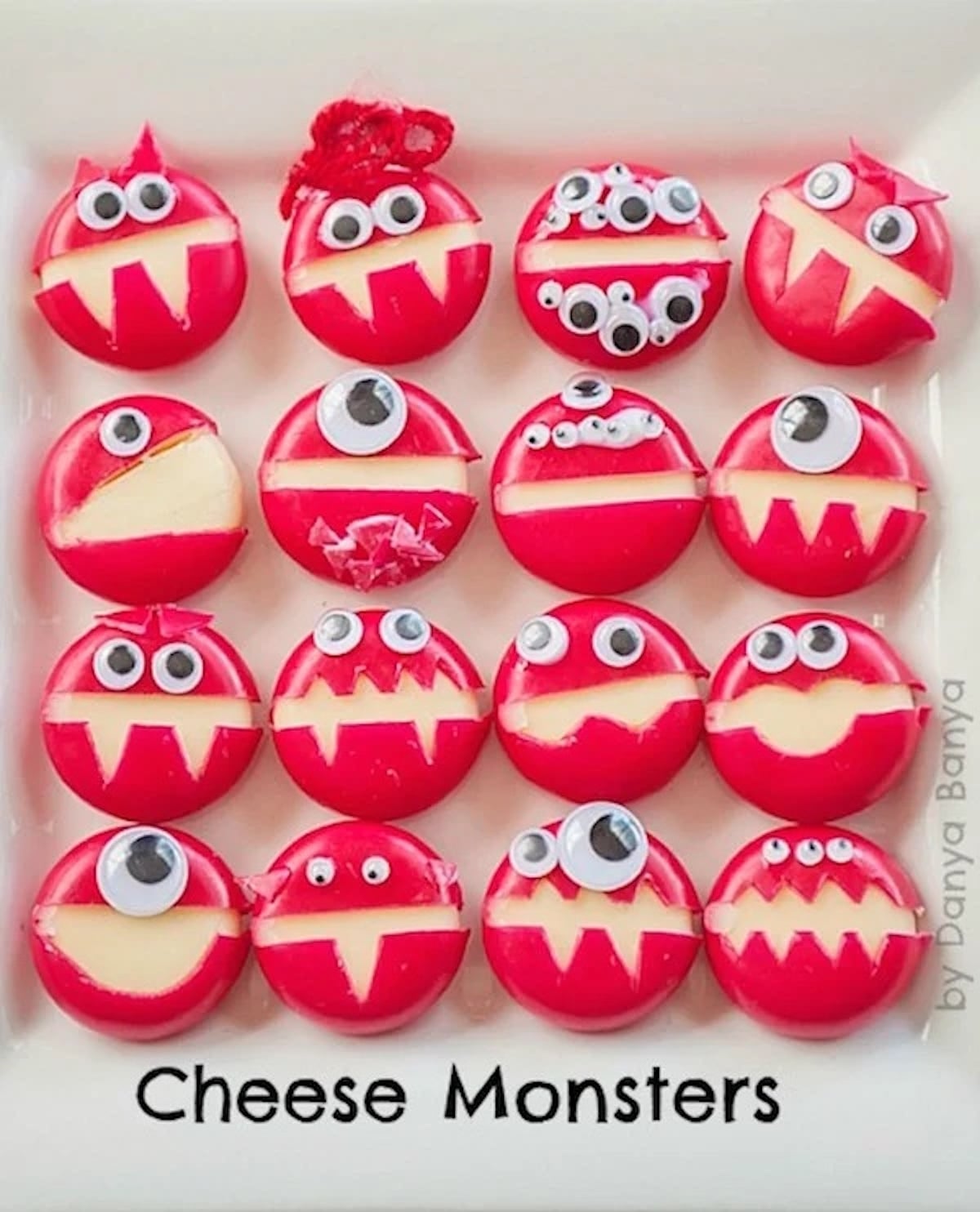 Babble cheese have been cut to look like monsters with teeth and garnished with googly eyes.