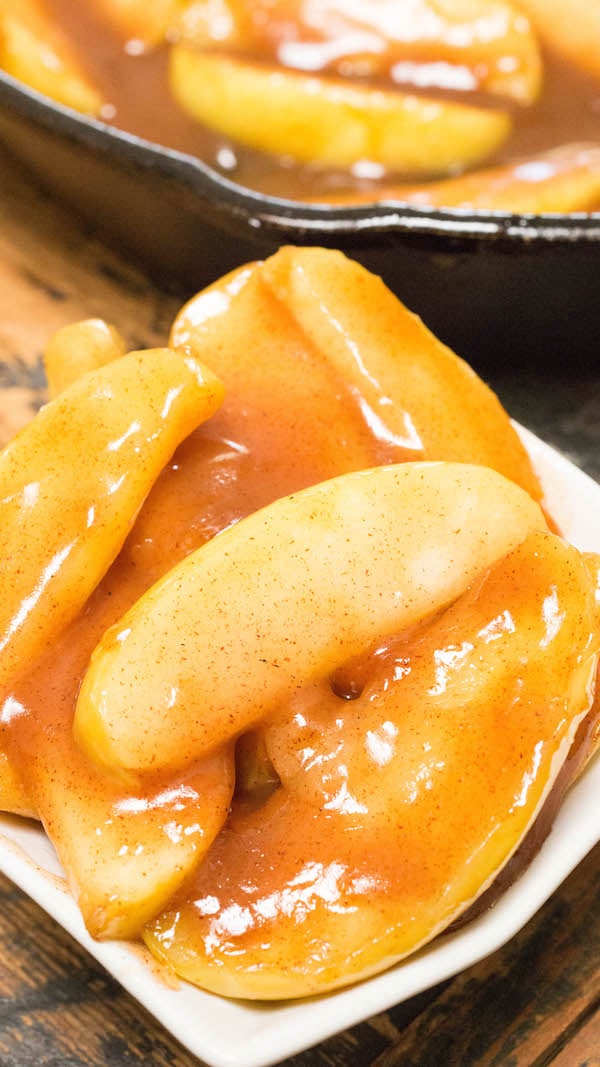 Close up of homemade Cracker Barrel Fried Apples in a white serving dish.