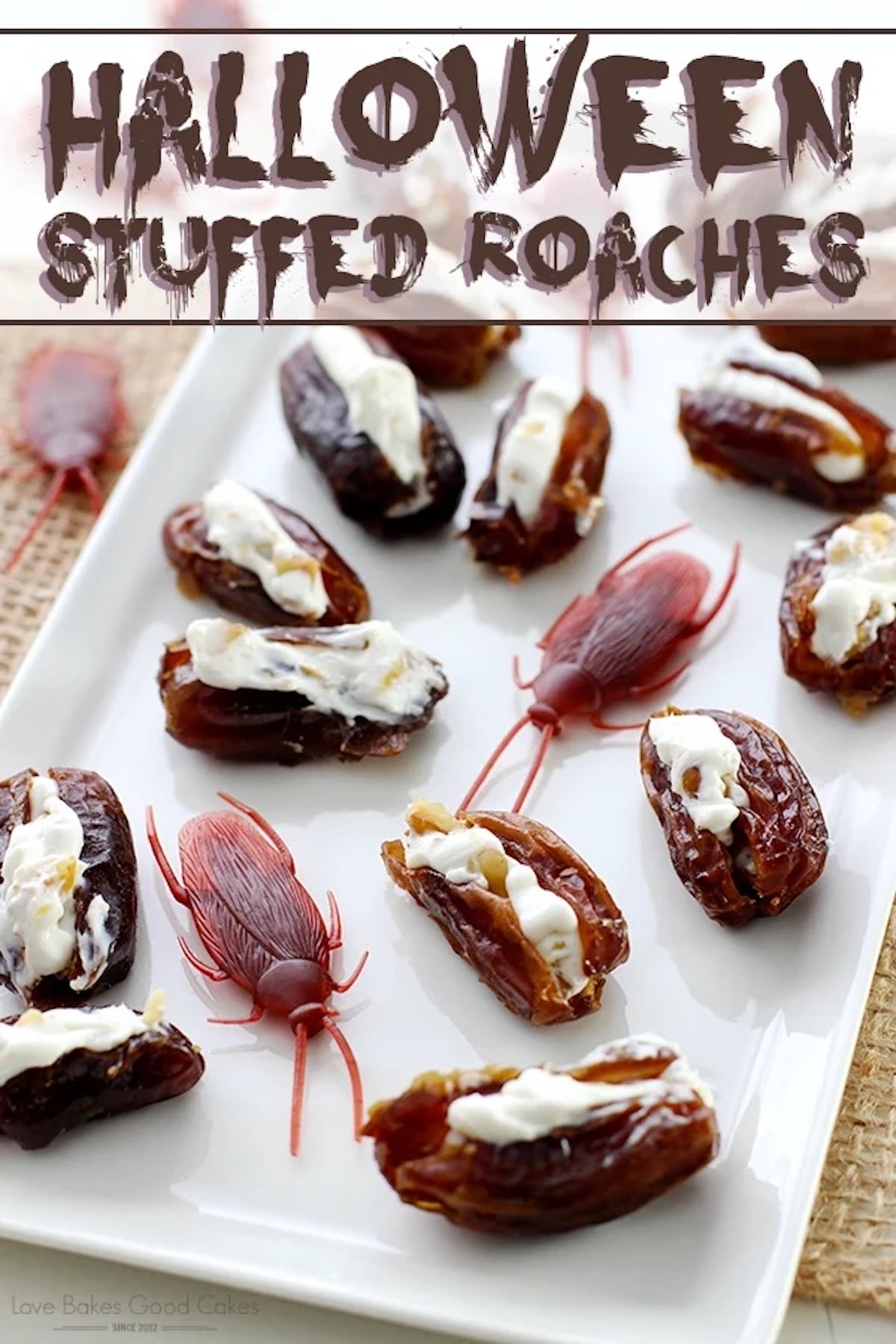 Dates have been sliced open and stuffed with a white filling and placed next to toy cock roaches on a serving plate. Text at the top reads "Halloween stuffed roaches".