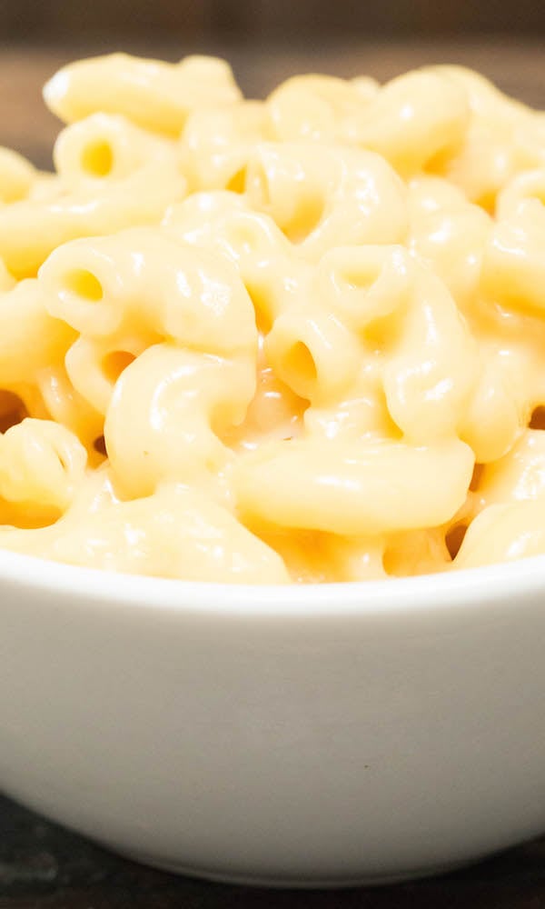 Close up of Instant Pot Mac and Cheese in a white serving bowl.