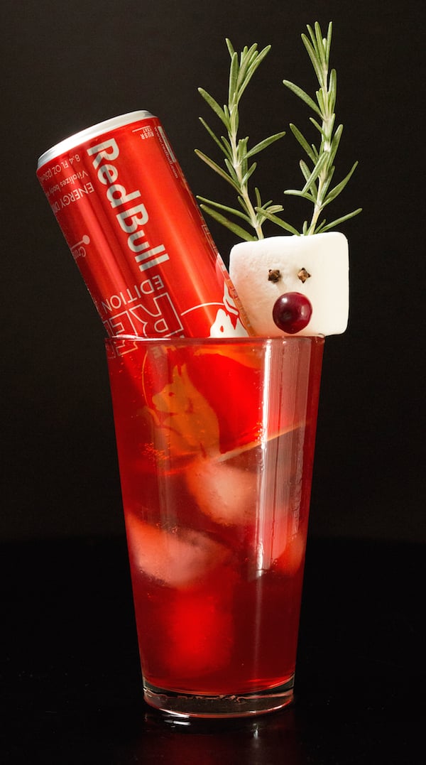 Rudolph the Red Bull Cocktail in a pint glass on black background. 