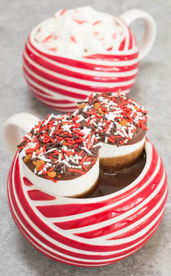 Crock Pot Peppermint Hot Chocolate in candy cane striped mugs.