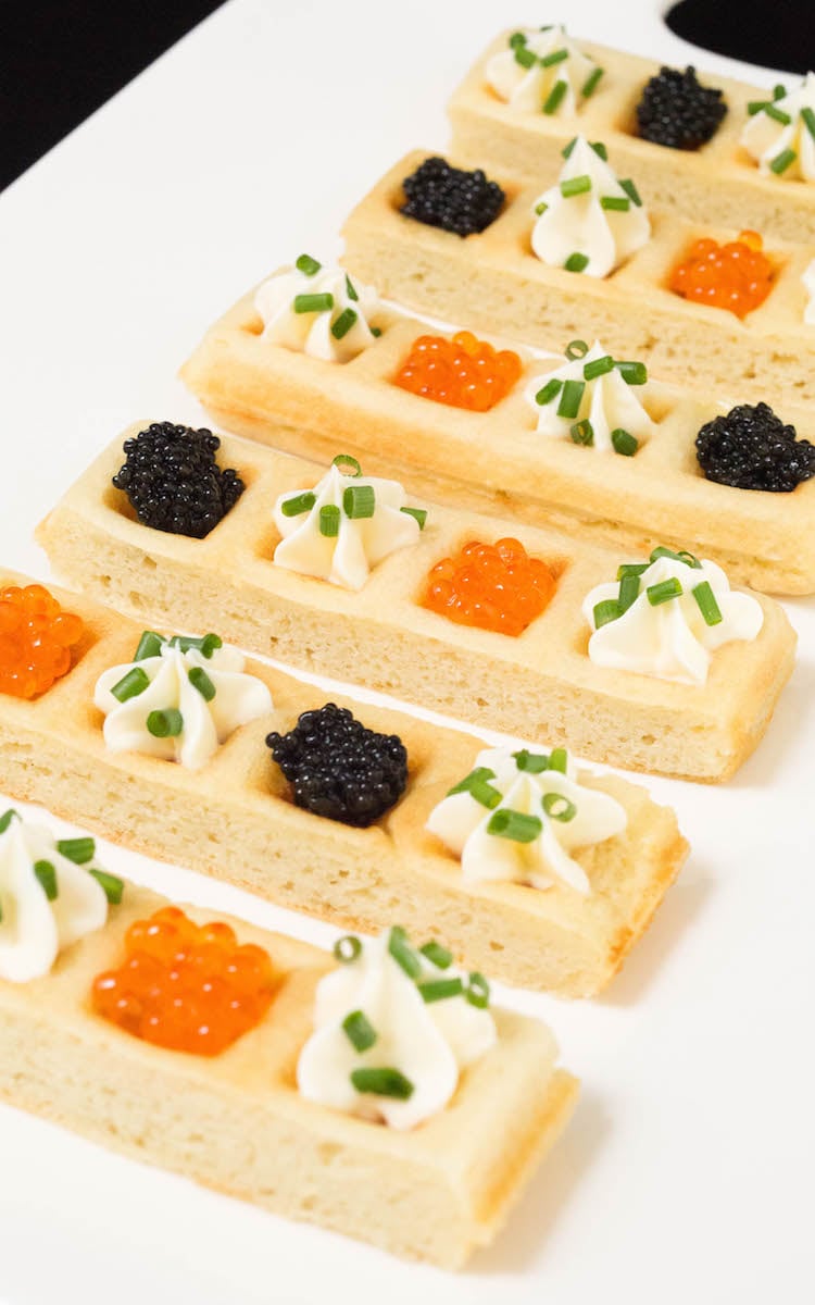 Caviar Waffle Sticks on a white serving platter.