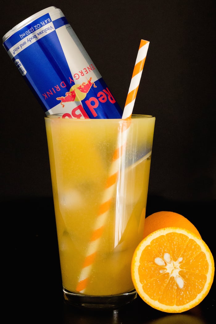 Red Bull Vitamin C Cocktail garnished with a Red Bull can.