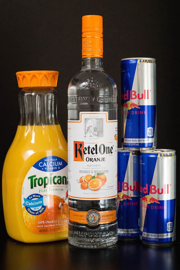 Red Bull Vitamin C Cocktail Ingredients - Orange juice, orange vodka, and Red Bull.