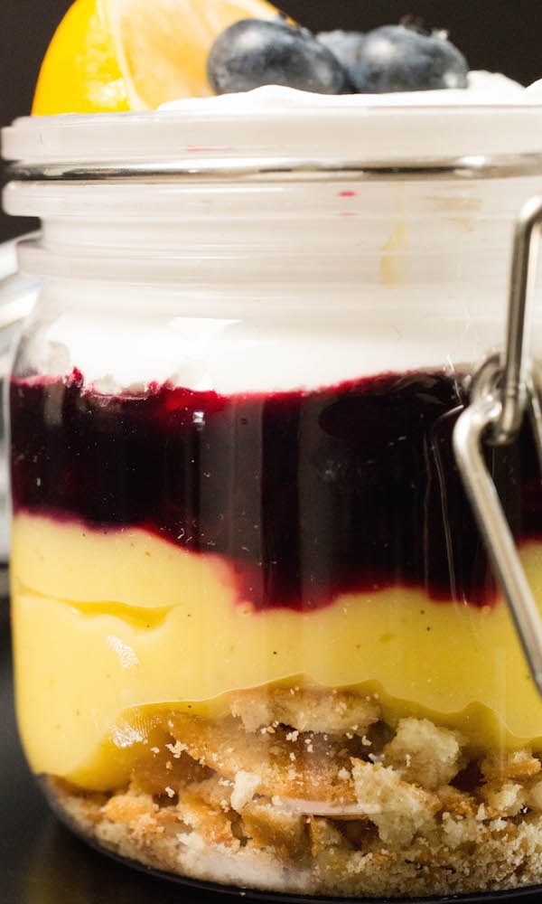 Close up showing Nilla wafers, lemon curd, blueberry compote, and cool whip to make Meyer lemon parfaits.