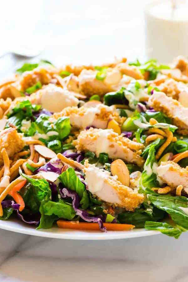 Applebees Oriental Chicken Salad in a white bowl on a white background