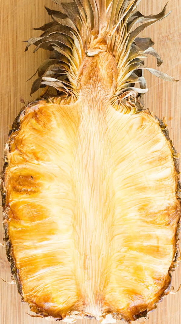 Medium shot of a half pineapple that has been smoked in a meat smoker