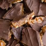 Close up shot of multiple pieces of butter toffee sitting on top of each other