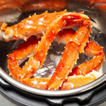 Overhead view of an Instant Pot that is full of King Crab legs