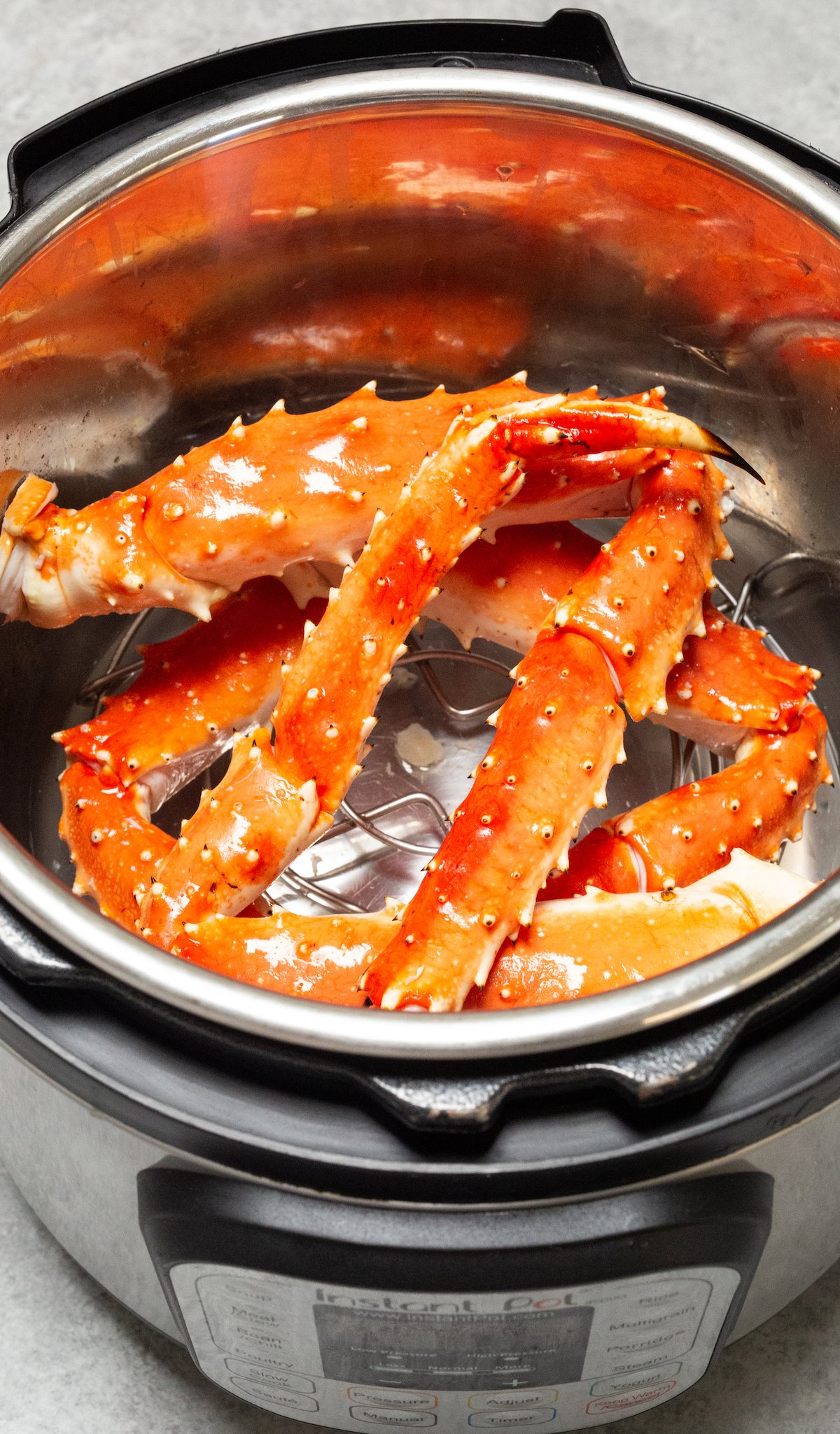 Overhead view of an Instant Pot that is full of King Crab legs