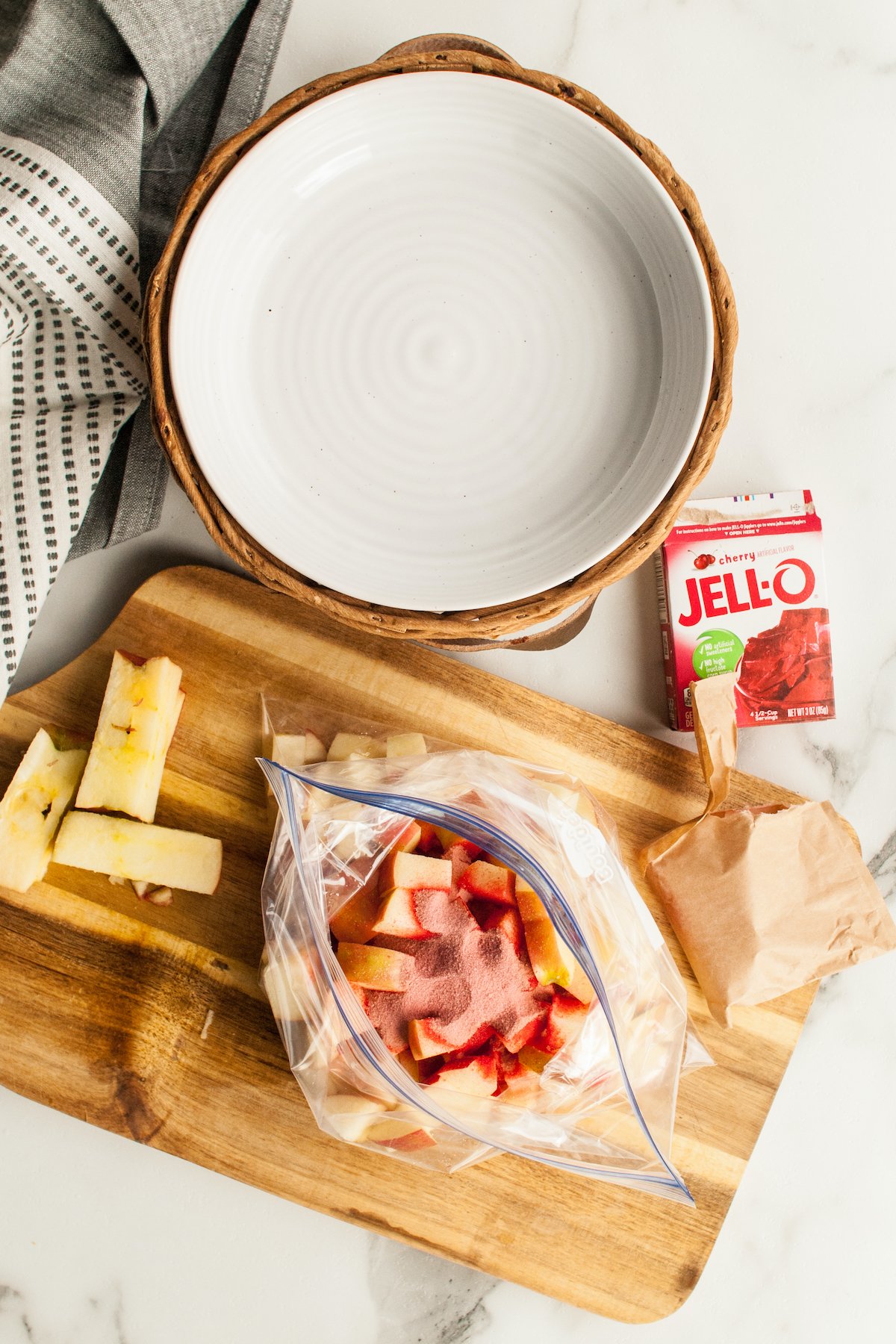 Chopped apple in a ziploc bag have Jello powdered added on top