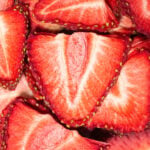 Overhead view of bright red strawberry slices that have been dehydrated.